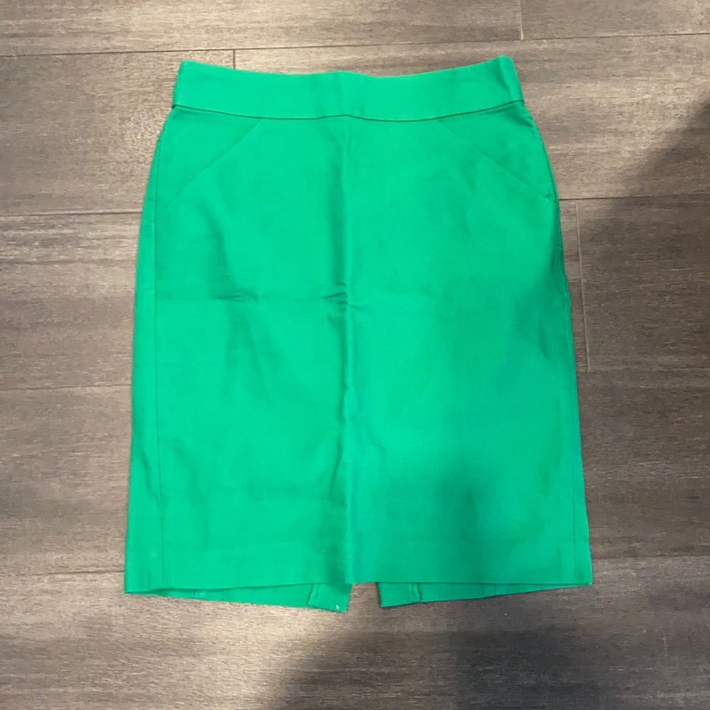 Gently worn J. Crew Green pencil skirt slit in back with pockets!